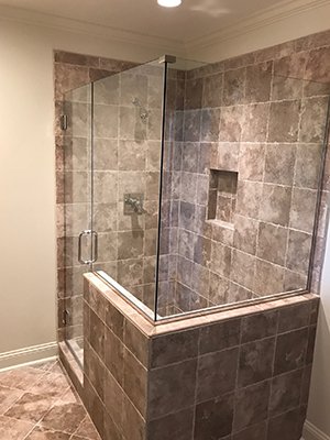 Frameless corner shower enclosure, stone tile — Myrtle Beach Shower Door